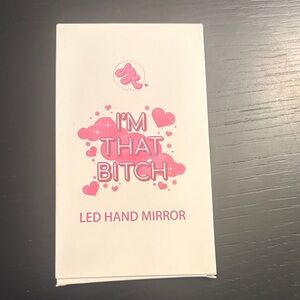 LED Hand Mirror with Pink Accents